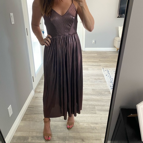 Urban Outfitters Pants - Metallic Urban outfitters Jumpsuit with wide leg.  Size medium